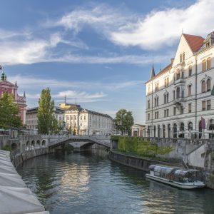 Ljubljana,Slovenia,Buildings and pedestrian bridge over urban canal, Ljubljana, Central Slovenia, Slovenia