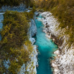 Emerald Green Soca River in Slovenia. Atumnal Foliage Colors