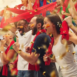Group of happy fans are cheering for their team victory. Collage made of 8 models.