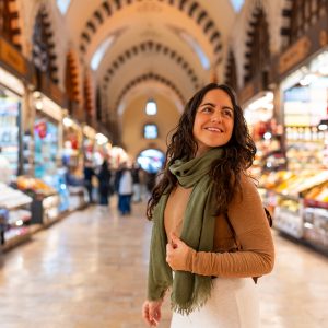 Happy woman tourist exploring bazaar market in Istanbul turkey