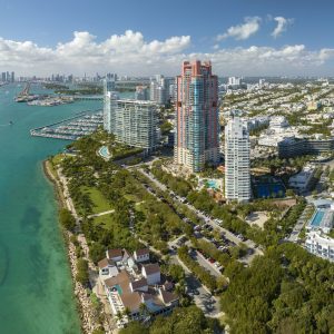 Miami Beach city American southern architecture. South Beach high luxurious hotels and apartment buildings. Tourist infrastructure in southern Florida, USA
