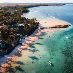 Aerial photography of the East coast of the island of Mauritius. Flying over the turquoise lagoon of Mauritius in the Belle Mare area.Coral reef of Mauritius. Mauritius Island Beach