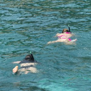tourist wearing a bikini swim in the sea in Phuket.