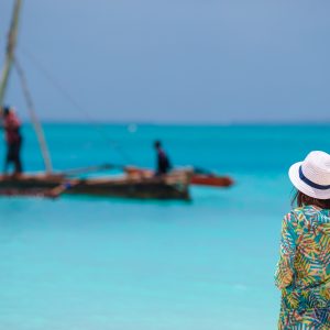 Young beautiful woman on beach during tropical vacation