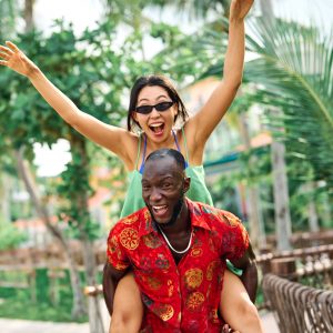 fun summer vacation woman couple love young man travel romance romantic embracing hug married two valentine day lover husband wife relationship carrying